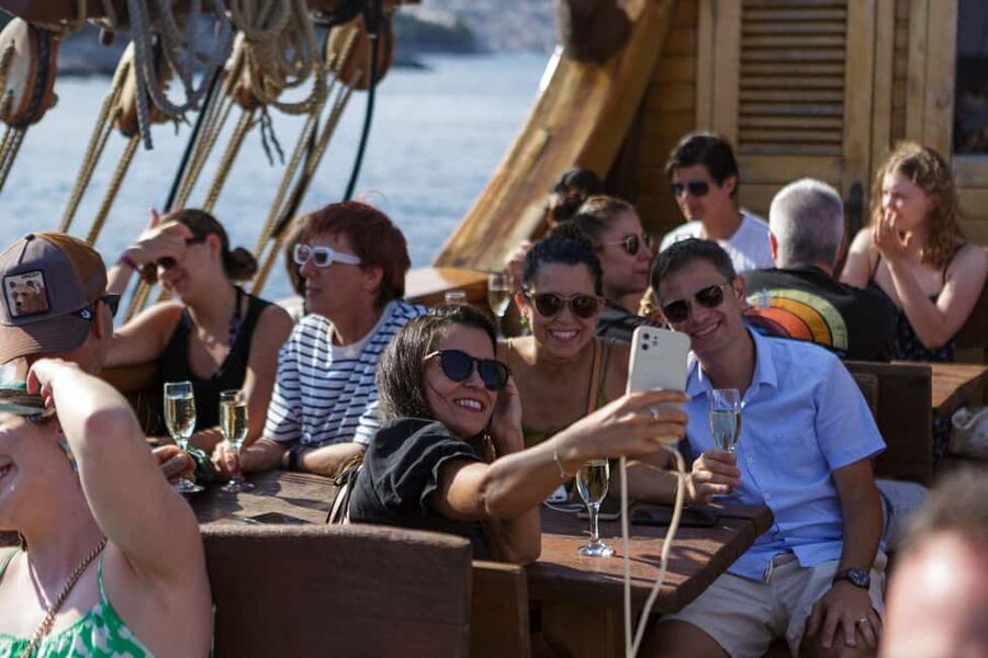 Dubrovnik: Galleon Sunset Cruise with a Live Guide & Drink - Entering Galleon Tirena: cross the plank, then relax